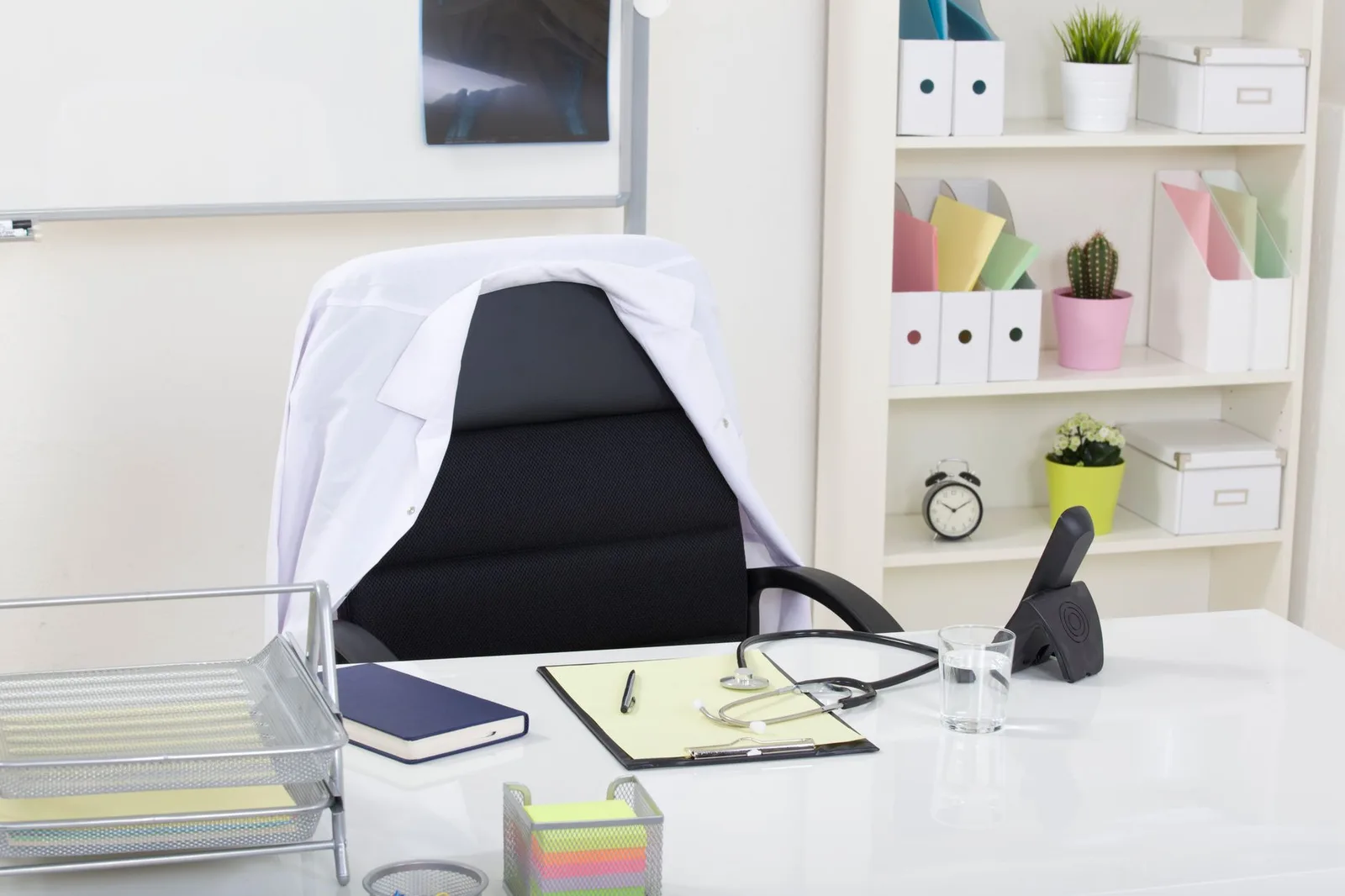 A clean and organized medical office featuring a stethoscope on a desk, symbolizing healthcare professionalism.