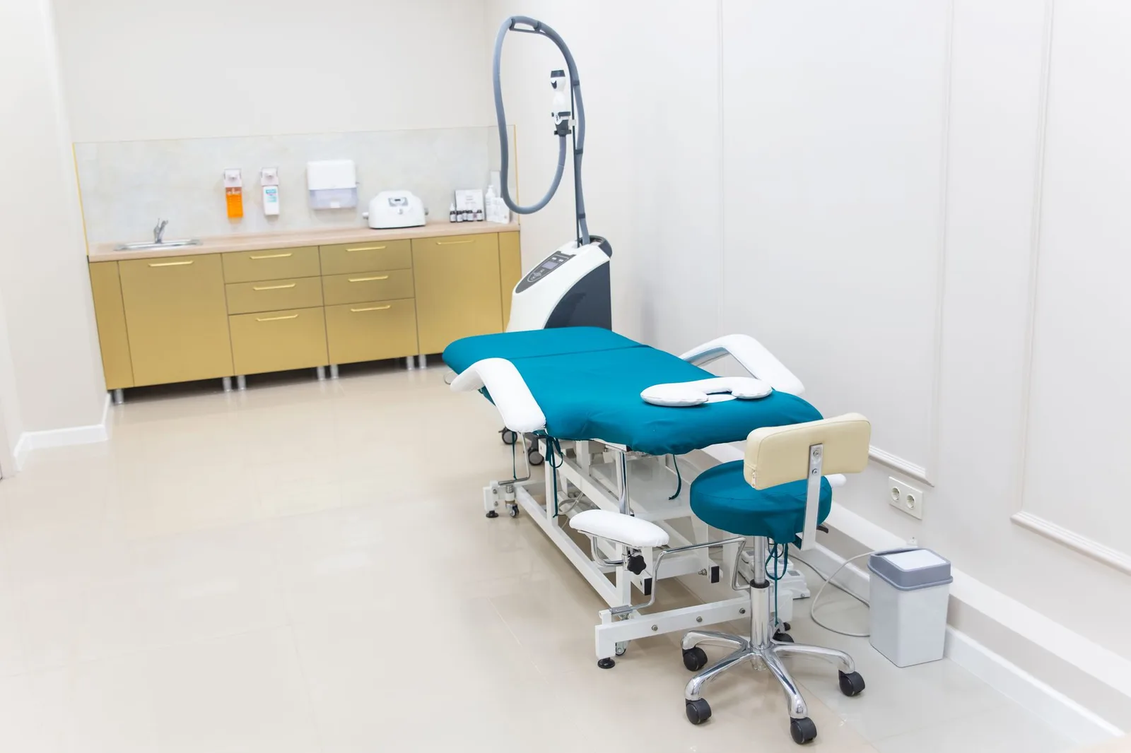 Clean and modern medical examination room with equipment ready for use.