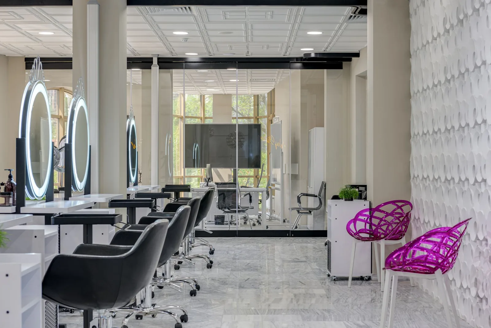 Chic salon space featuring sleek chairs, mirrors, and contemporary decor.